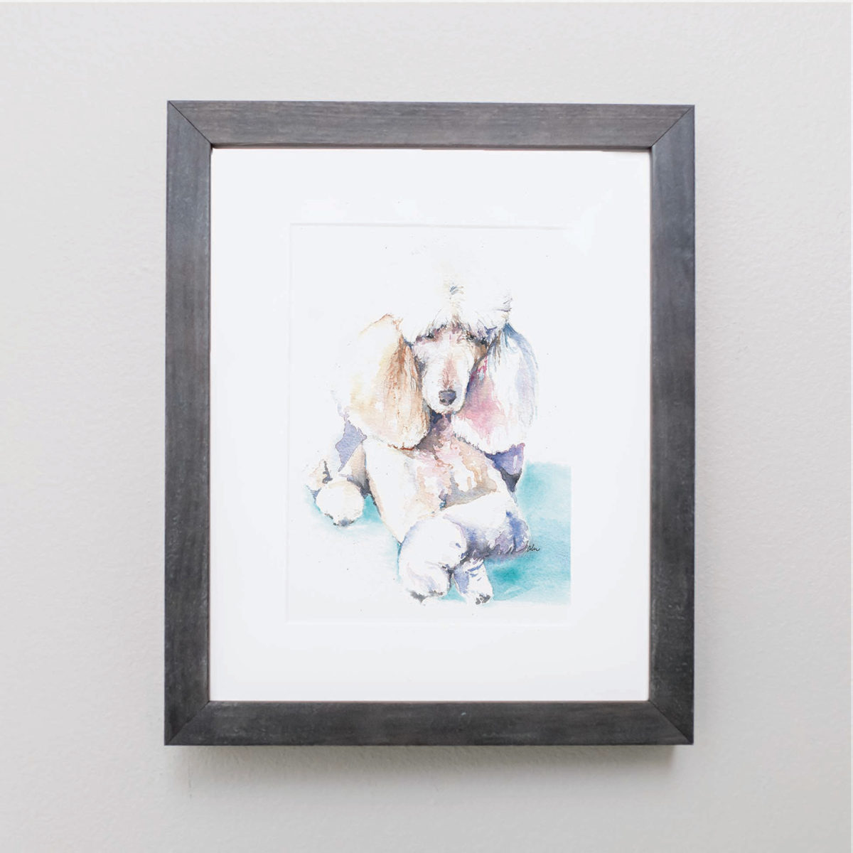 Watercolor of a poodle in a gray frame