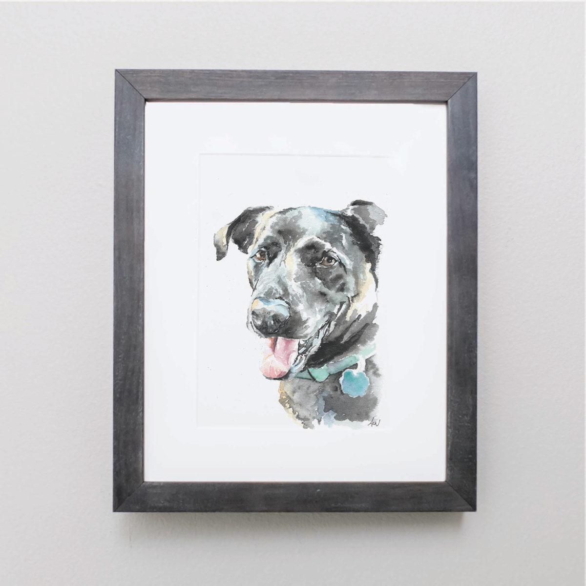 Watercolor of a black lab in a gray frame