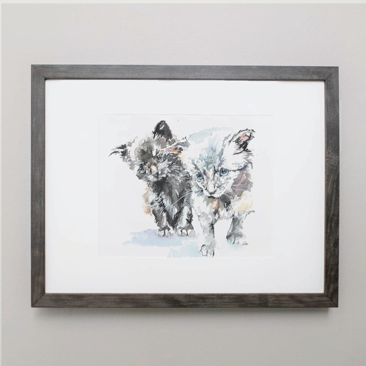 Watercolor of two kittens in a gray frame