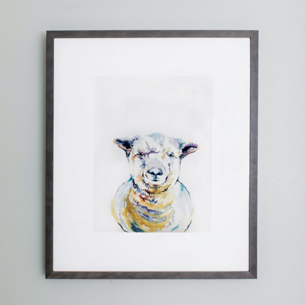 Watercolor of a sheep in a gray frame with white mat