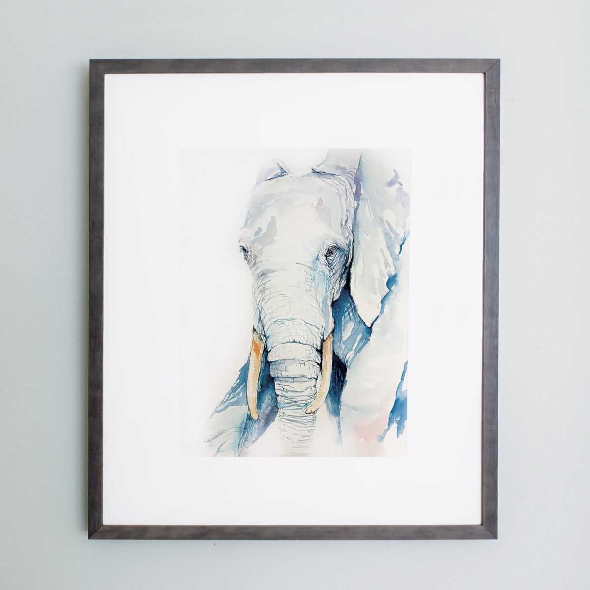 Watercolor of blue elephant framed