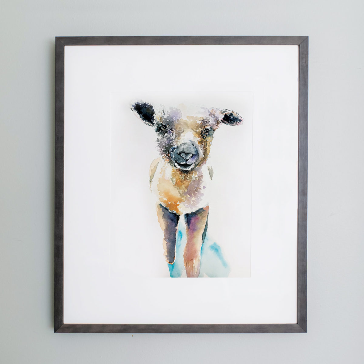 Watercolor of a lamb framed