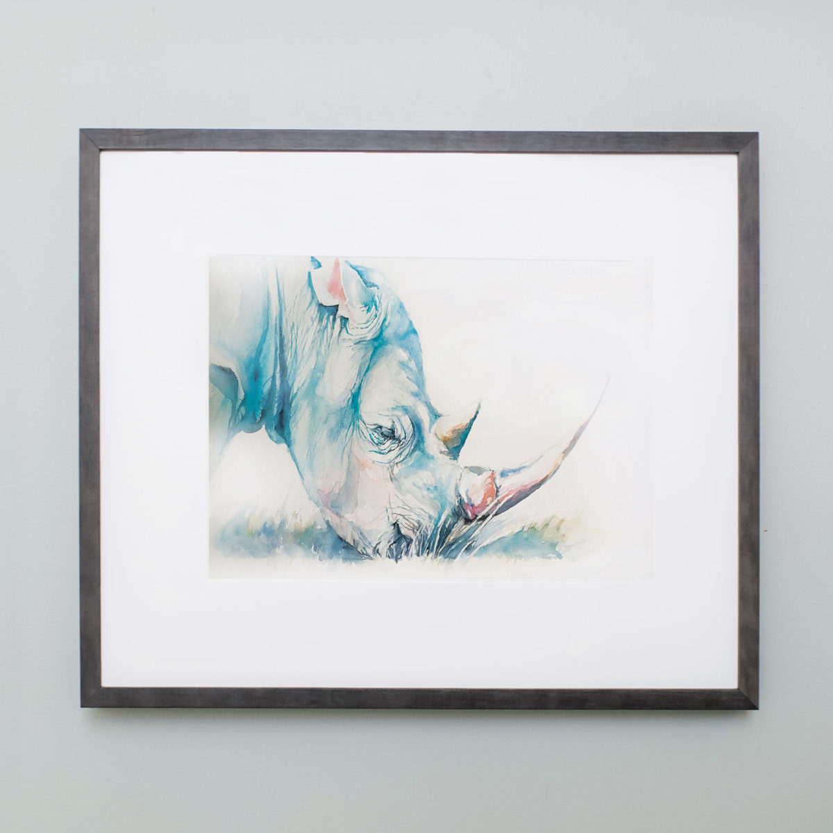 Watercolor of rhino in gray frame