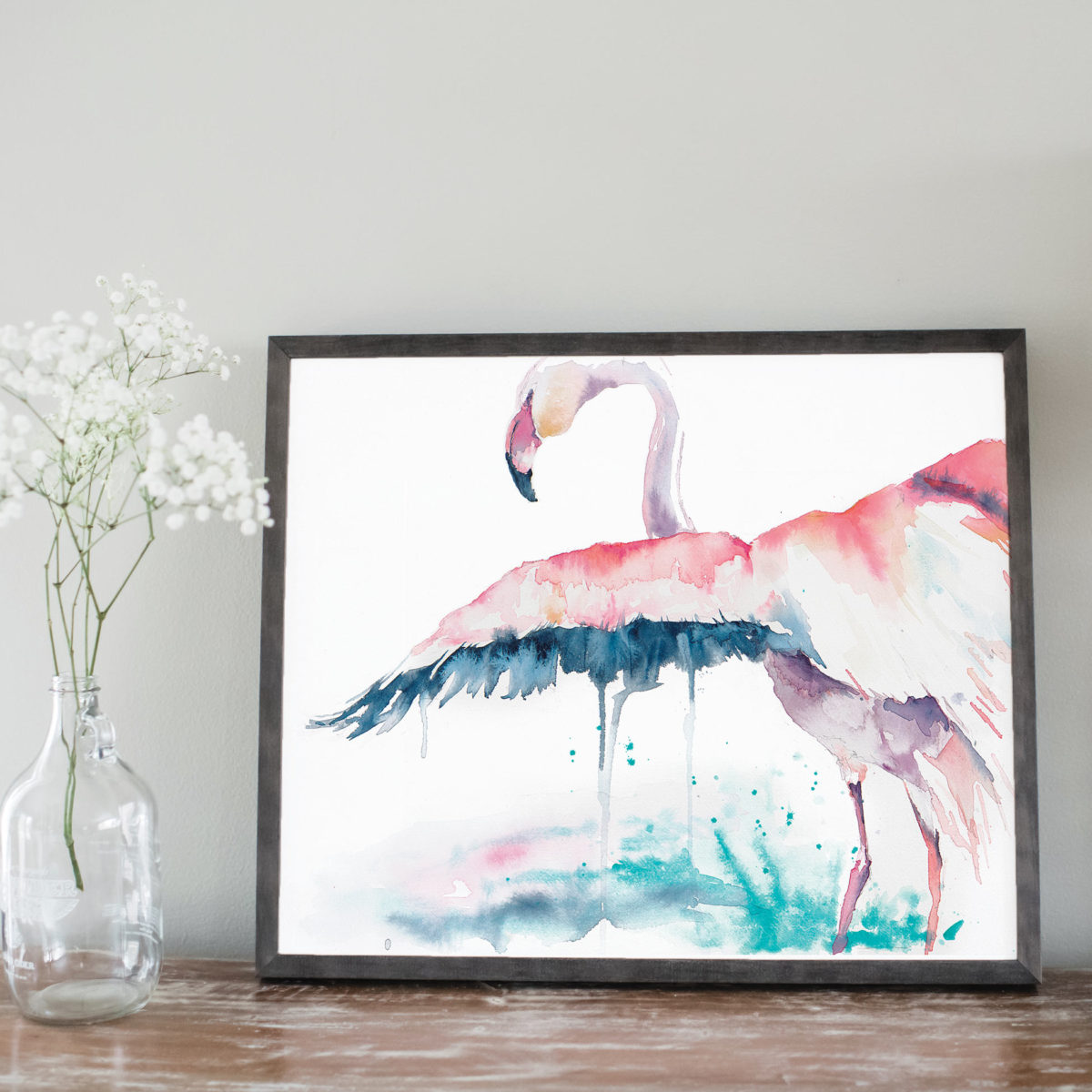 Watercolor of flamingo with wing spread in gray frame