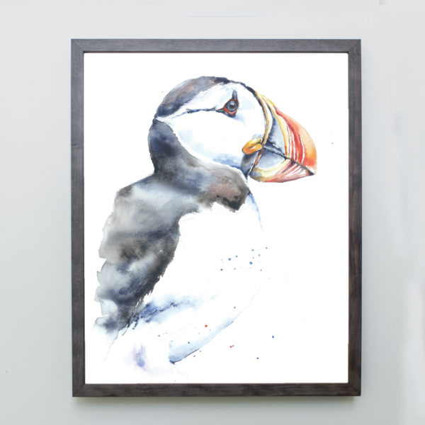 Watercolor of a puffin in a gray frame