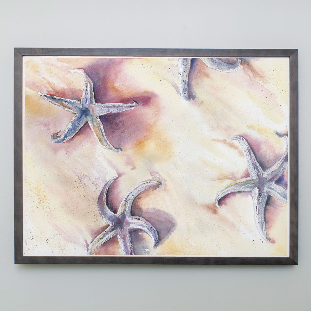 Watercolor of starfish in a gray frame