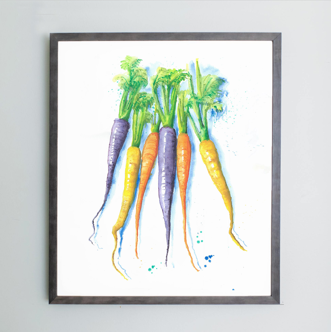Watercolor image of purple, orange, and yellow carrots in gray frame